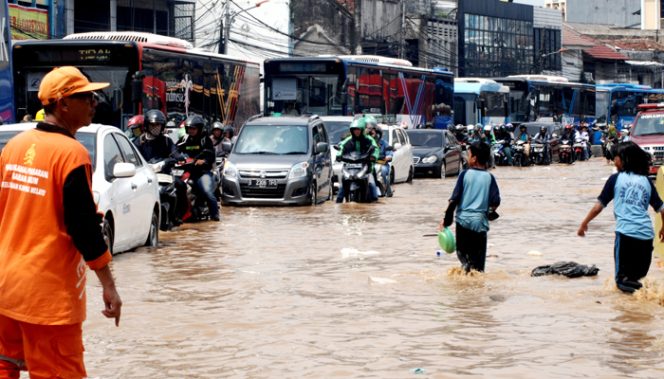 
					Ilustrasi banjir Jakarta. (FOTO : Poskota)